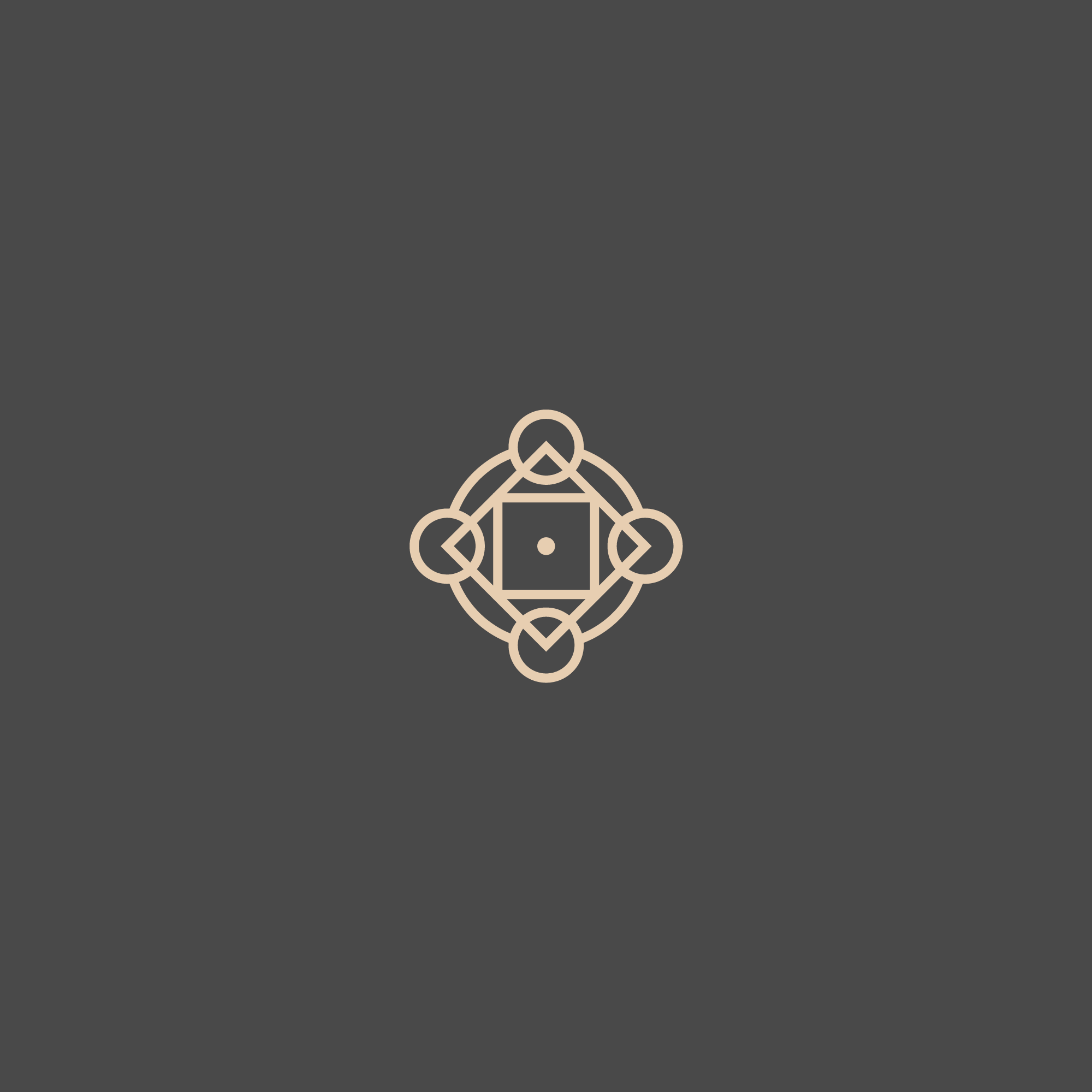 Enki Organics ornamental logo mark in beige on charcoal