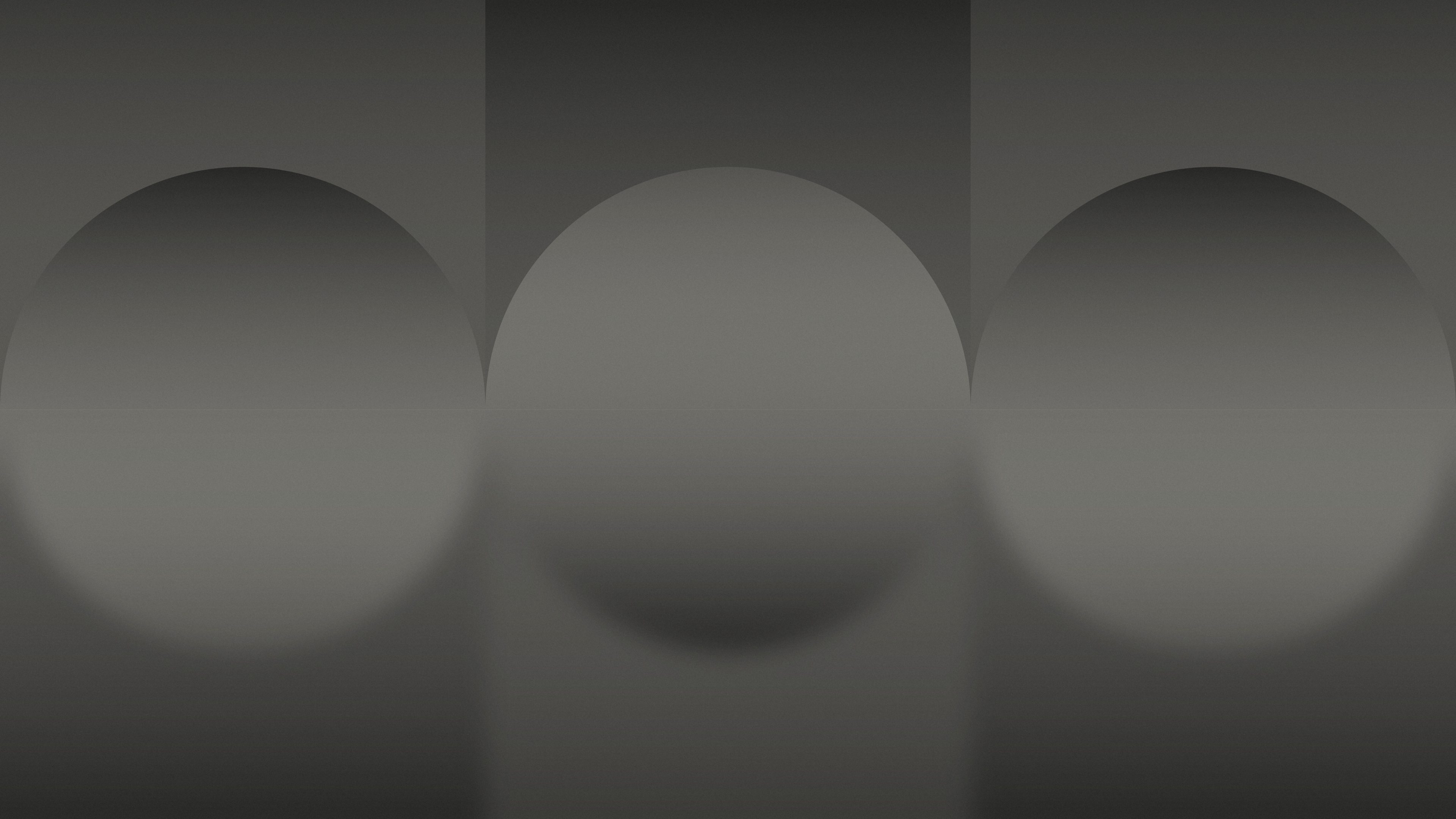 Dark desktop wallpaper of three soft gradient arches in charcoal