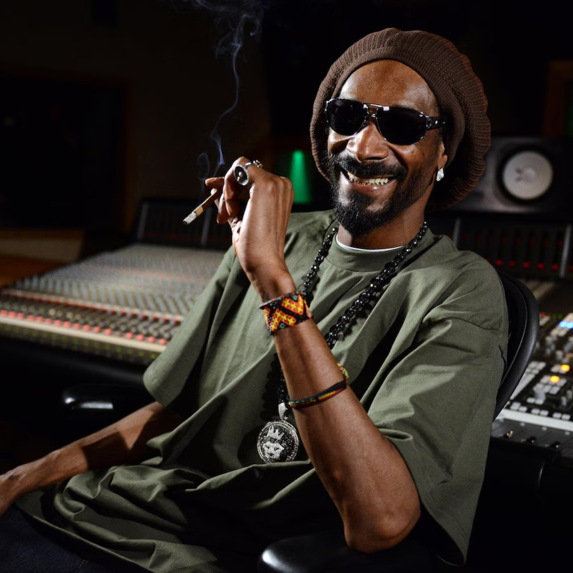 Artist in a recording studio wearing a King Ice lion-head pendant